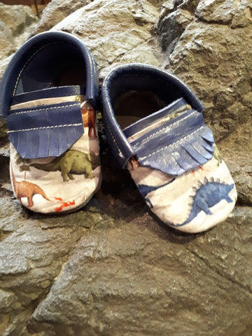 Blue leather with short fringe and dinosaur toe toppers.